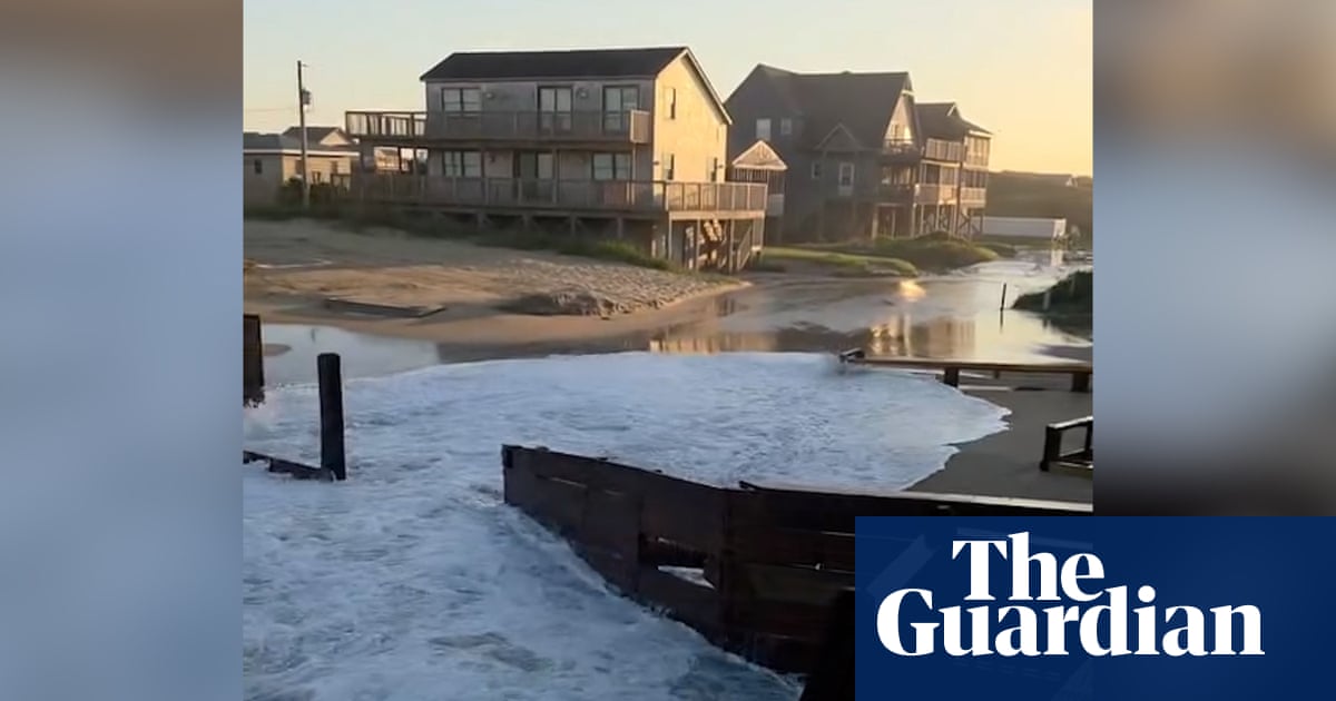Footage shows houses battered by waves during Hurricane Erin – video