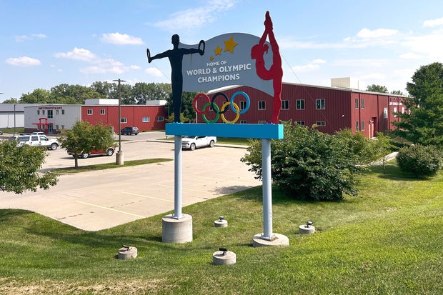 Ex-coach at U.S. gymnastics academy arrested by FBI after abuse reports