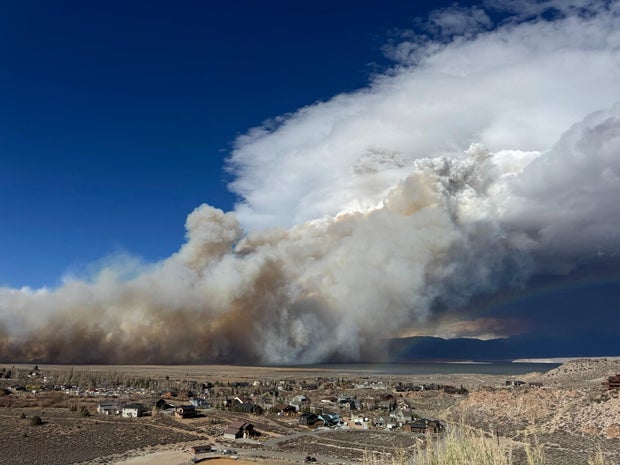 Calif. wildfire forces evacuations as storm threatens mudslides in south
