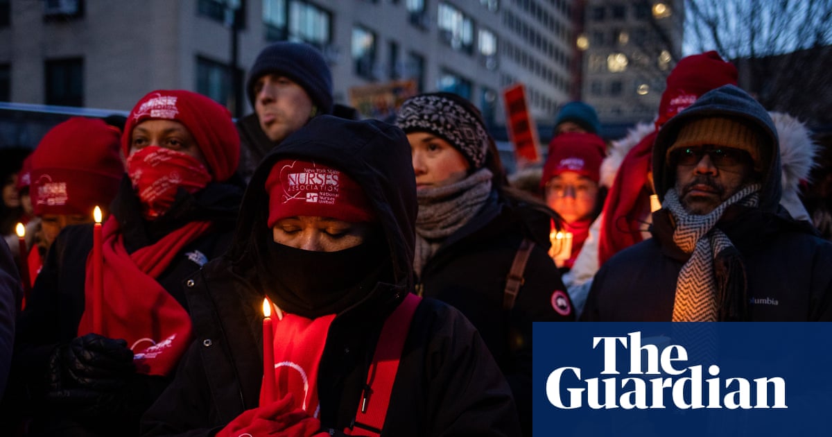 New York nurses hold candlelight vigil for Alex Pretti amid strike – in pictures